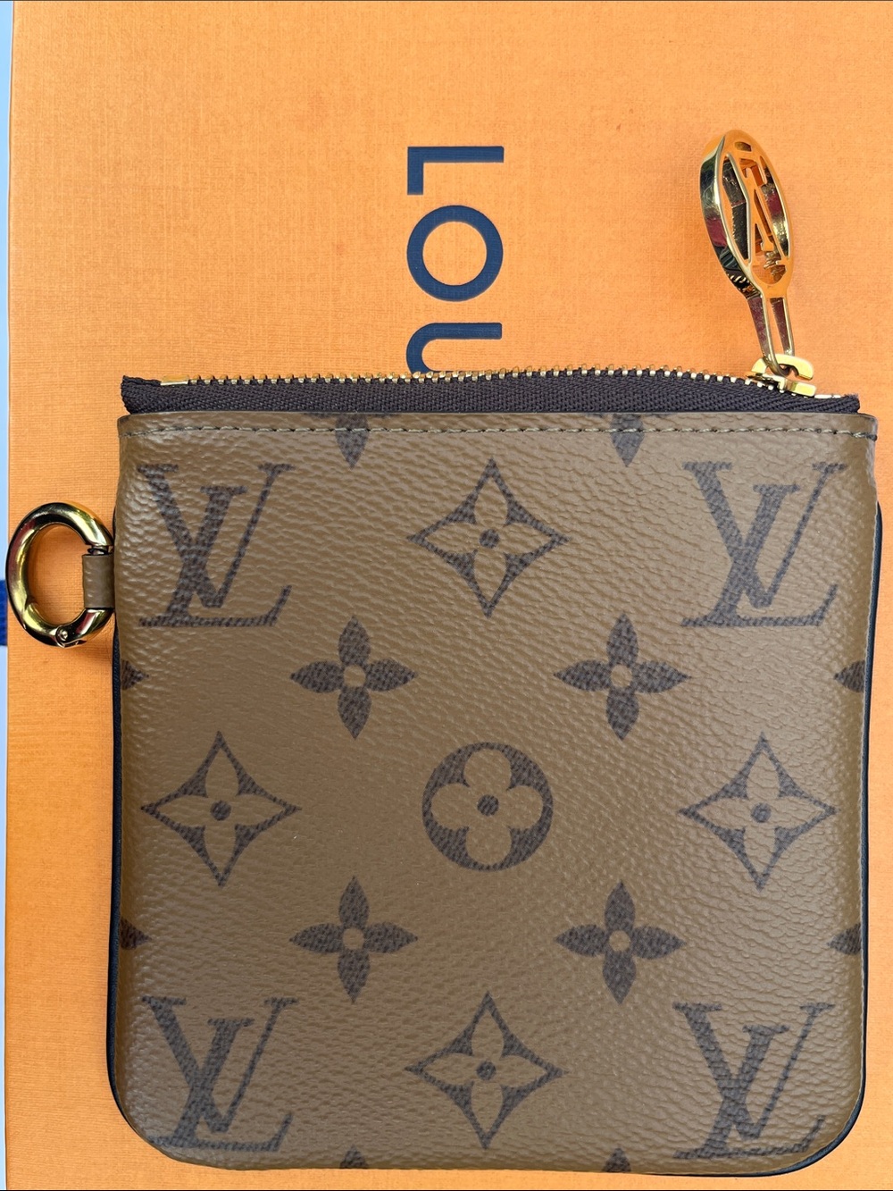 Louis Vuitton LV monogram reverse square pouch from Trio Pouch